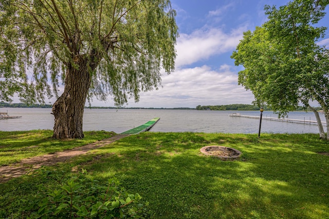 22077 Csah 14, Darwin, MN 55324 - view of grassy yard with an outdoor fire pit and a water view
