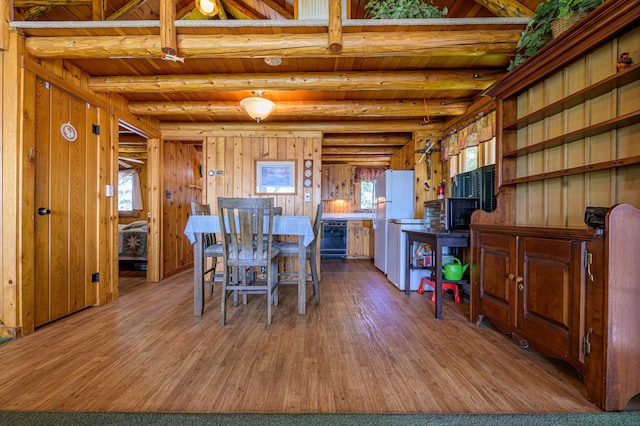 22077 Csah 14, Darwin, MN 55324 - dining space featuring wood finished floors, healthy amount of natural light, a wooden ceiling with exposed beams, and wooden walls