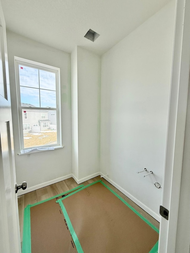 empty room with hardwood / wood-style floors