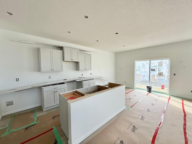 kitchen featuring a textured ceiling