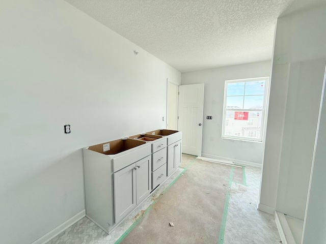 bathroom featuring a textured ceiling