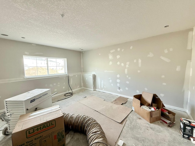 empty room with a textured ceiling