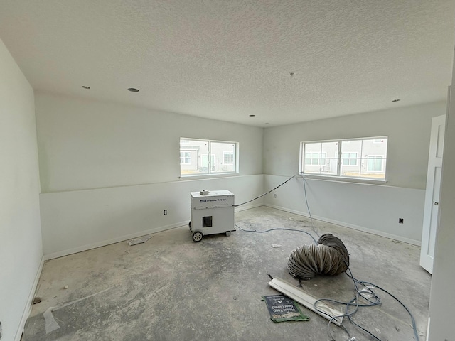 empty room with a textured ceiling