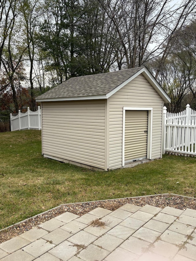 garage featuring a yard