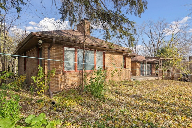 view of side of property with a patio