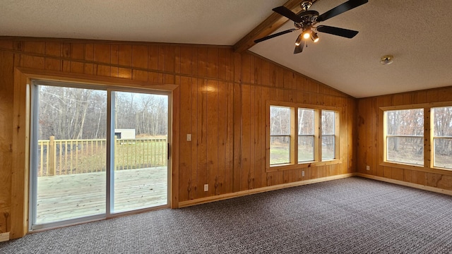 unfurnished sunroom with vaulted ceiling with beams and ceiling fan