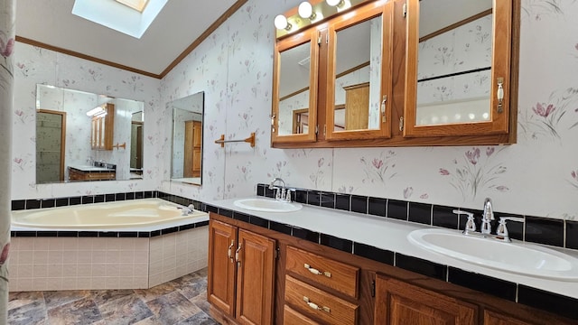 bathroom featuring tiled bath, crown molding, vaulted ceiling with skylight, and vanity