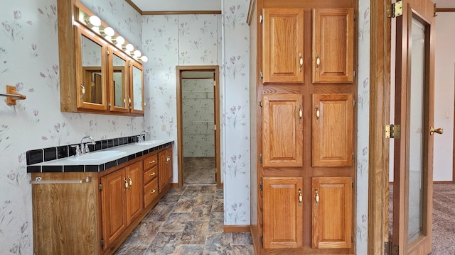 bathroom featuring vanity and ornamental molding