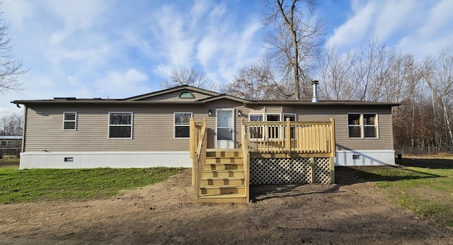 back of property featuring a wooden deck