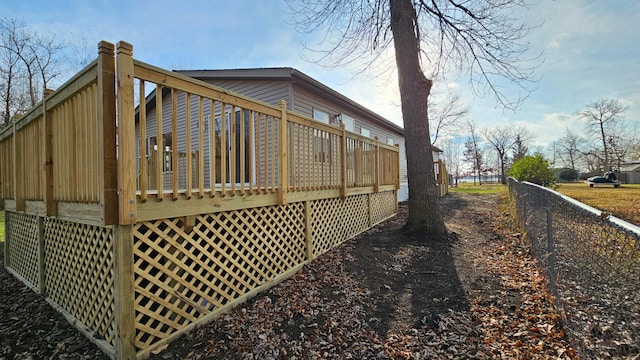 view of side of property with a deck