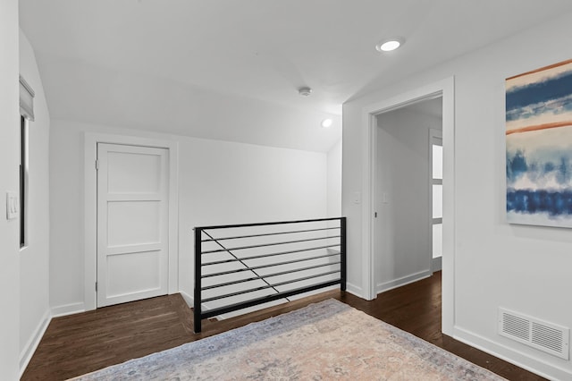 unfurnished bedroom featuring dark hardwood / wood-style floors