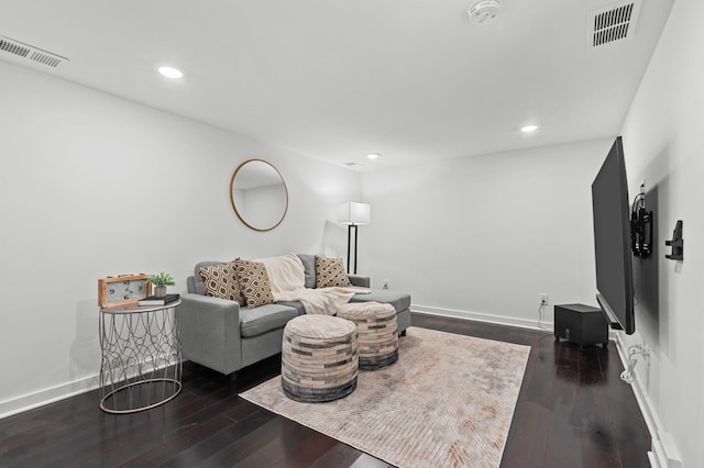 living room featuring dark wood-type flooring