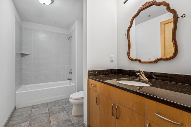 full bath featuring washtub / shower combination, tile patterned flooring, vanity, and toilet