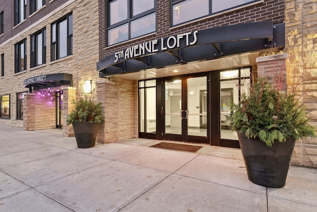 view of exterior entry featuring french doors