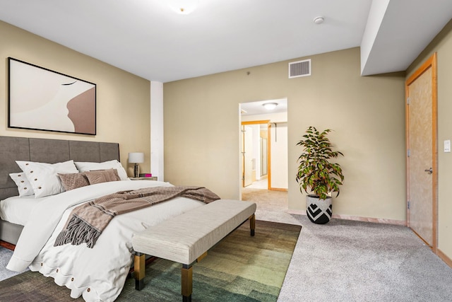 bedroom featuring carpet, visible vents, and baseboards