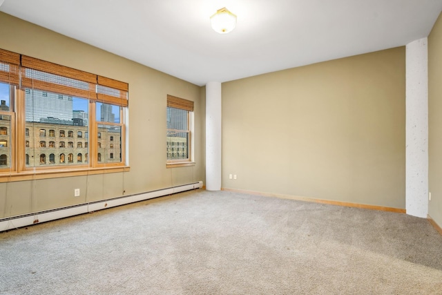 unfurnished room with carpet, a baseboard heating unit, a city view, and baseboards