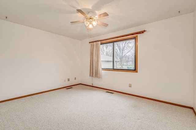 empty room with carpet and ceiling fan