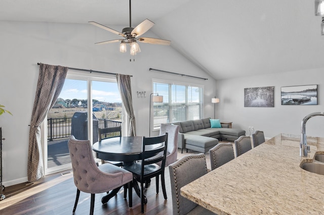 dining area with dark wood-type flooring, ceiling fan, a healthy amount of sunlight, and sink