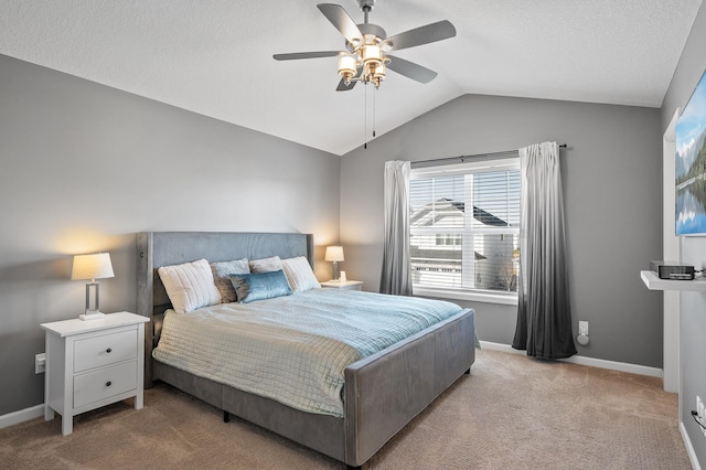 carpeted bedroom featuring ceiling fan and lofted ceiling