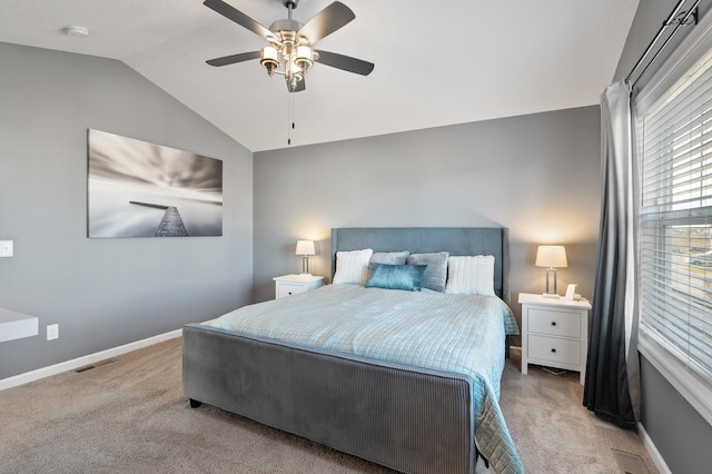 carpeted bedroom with lofted ceiling and ceiling fan