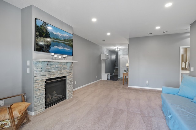 unfurnished living room featuring a fireplace and light colored carpet