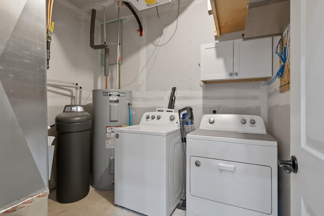 clothes washing area with cabinets, separate washer and dryer, and water heater