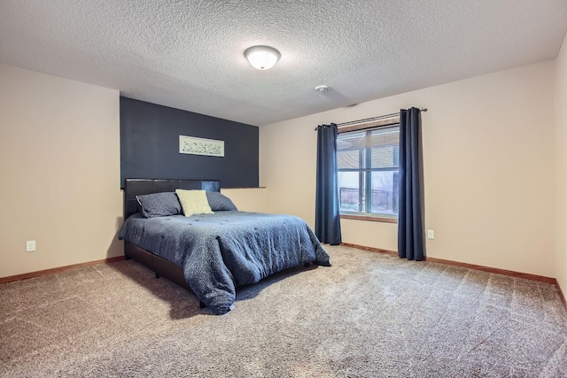 carpeted bedroom featuring a textured ceiling