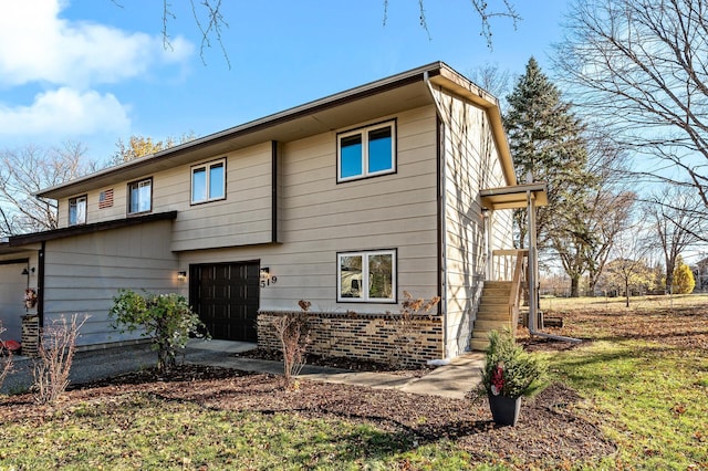 back of property featuring a garage