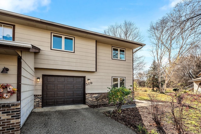 view of side of home with a garage