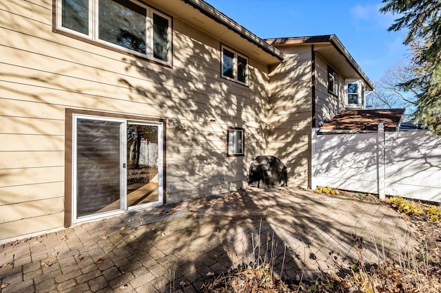 view of property exterior with a patio