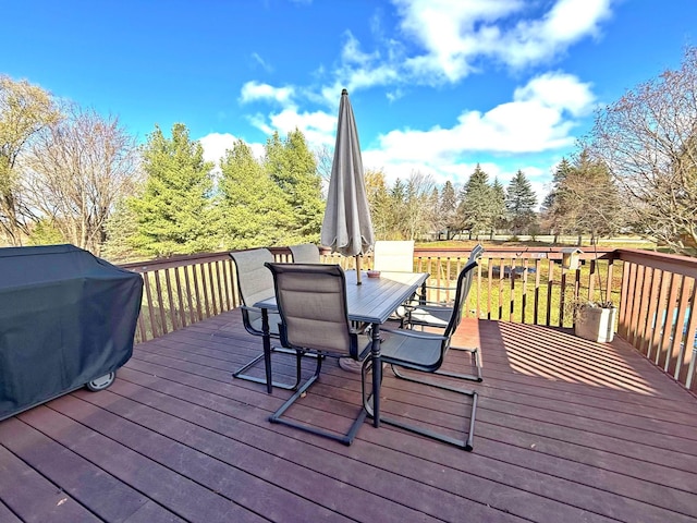 wooden deck with grilling area