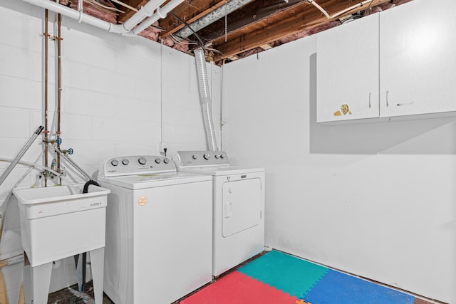 laundry area with cabinets and independent washer and dryer