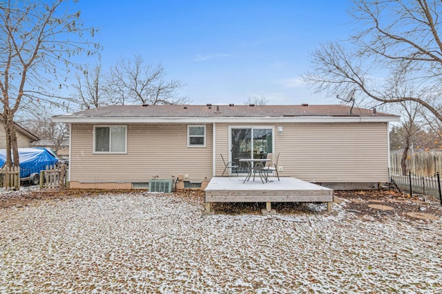 snow covered property featuring a deck