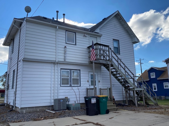 back of house with cooling unit