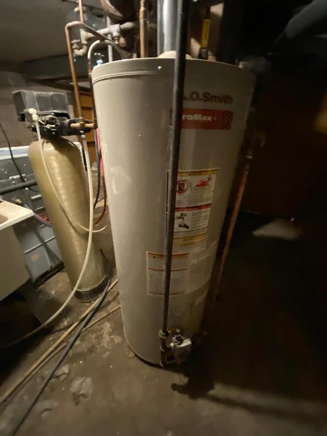 utility room featuring gas water heater