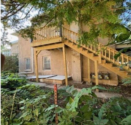 217 Spring St, Mankato, MN 56001 - back of property with stairway and stucco siding