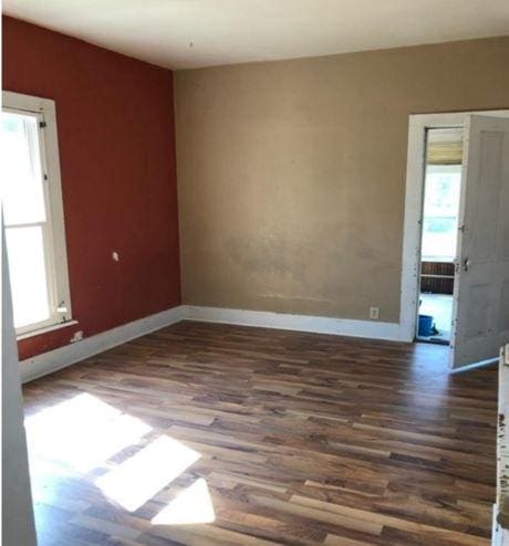 217 Spring St, Mankato, MN 56001 - spare room featuring healthy amount of natural light and wood finished floors