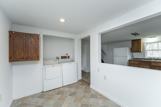 4163 Horseshoe Ct NE, Haverhill Twp, MN 55906 - laundry area featuring washing machine and dryer and sink