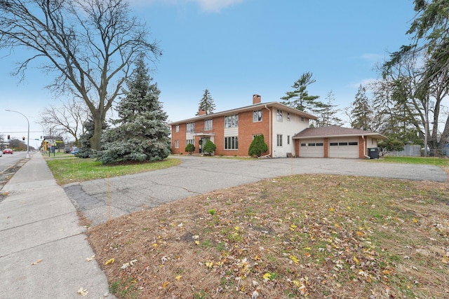 view of front of home with a garage and a front yard