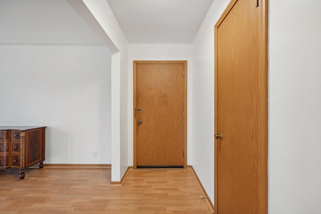 corridor featuring light hardwood / wood-style flooring