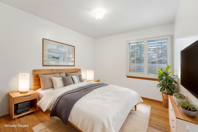 bedroom with light hardwood / wood-style flooring