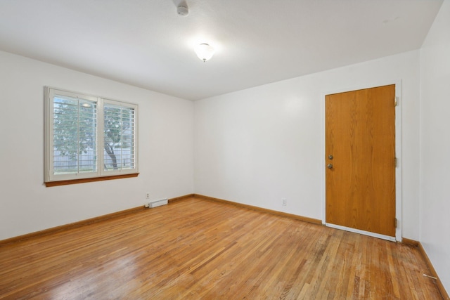 empty room with light wood-type flooring