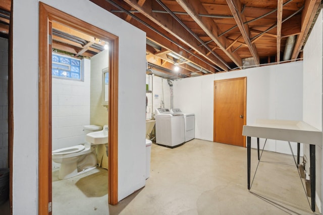 basement featuring washing machine and clothes dryer