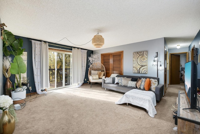 living room featuring carpet floors and a textured ceiling