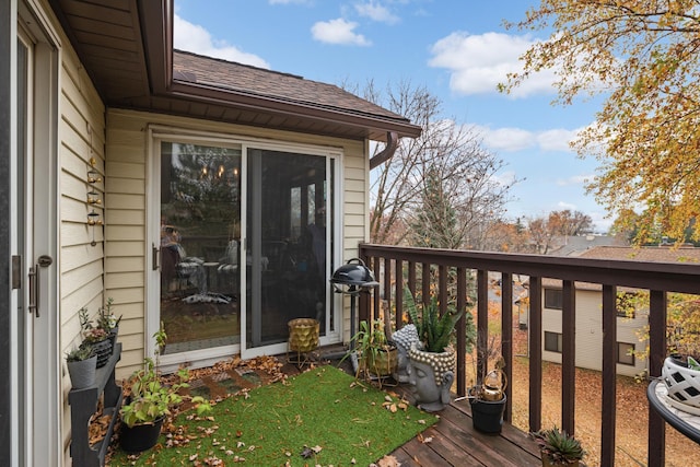 wooden deck featuring a grill