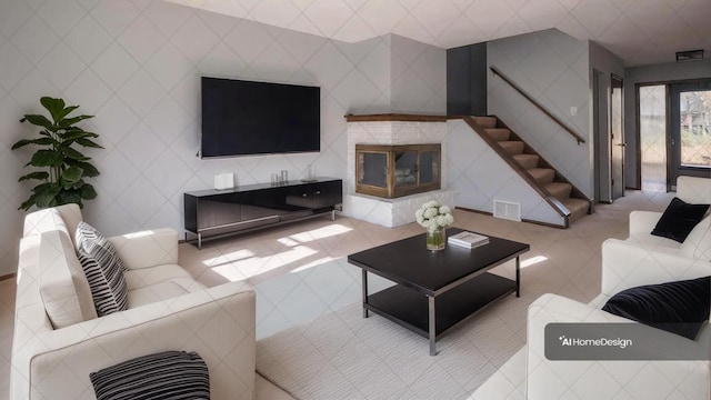 living room with tile walls, a fireplace, and light tile patterned floors