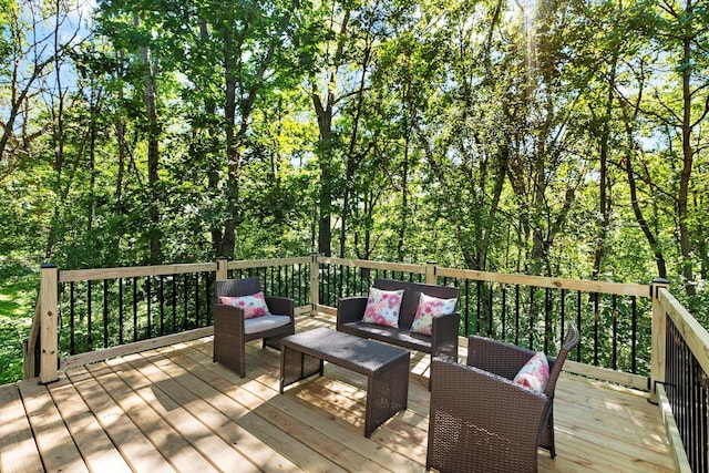 wooden terrace featuring outdoor lounge area