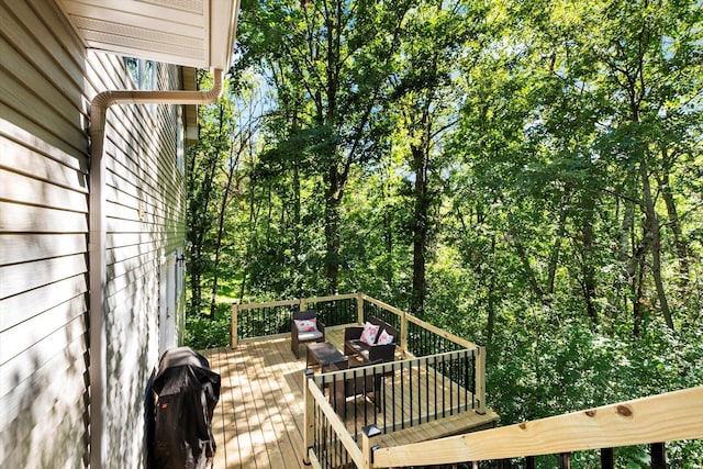 wooden deck featuring outdoor lounge area and grilling area