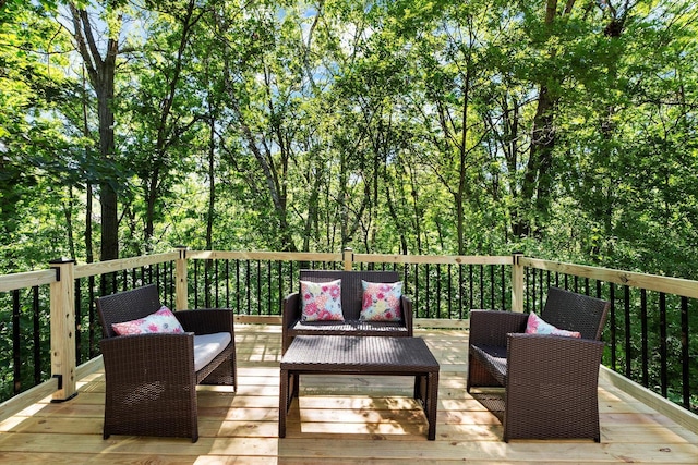 wooden terrace featuring an outdoor hangout area