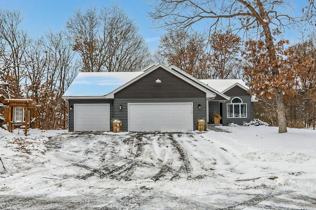 ranch-style home featuring a garage